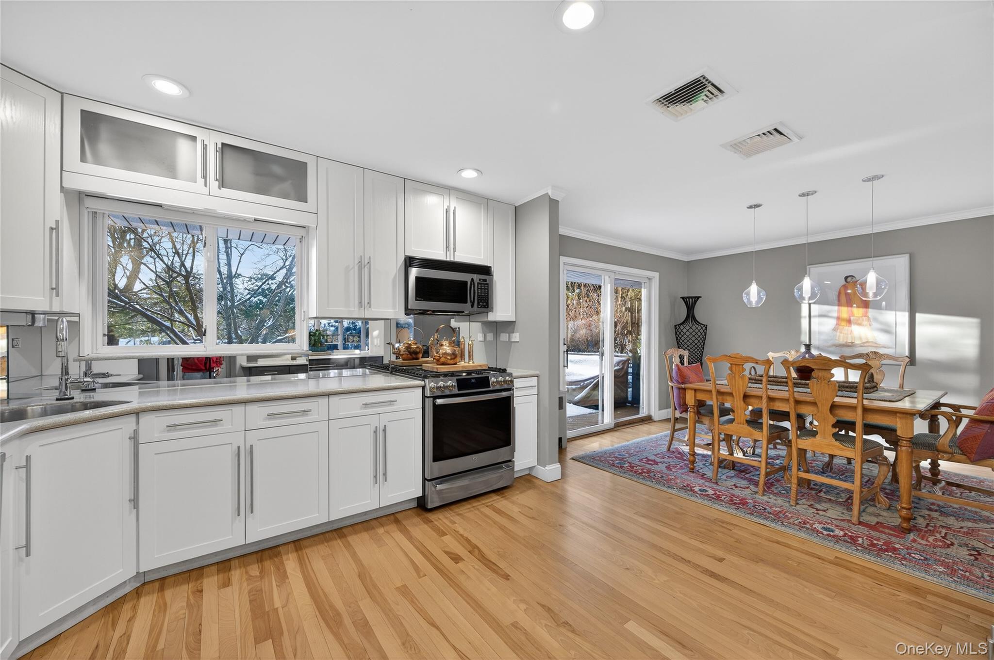 6 Dale Avenue Syosset, NY 11791 - Photo 11 of 34 a large kitchen with cabinets table and chairs