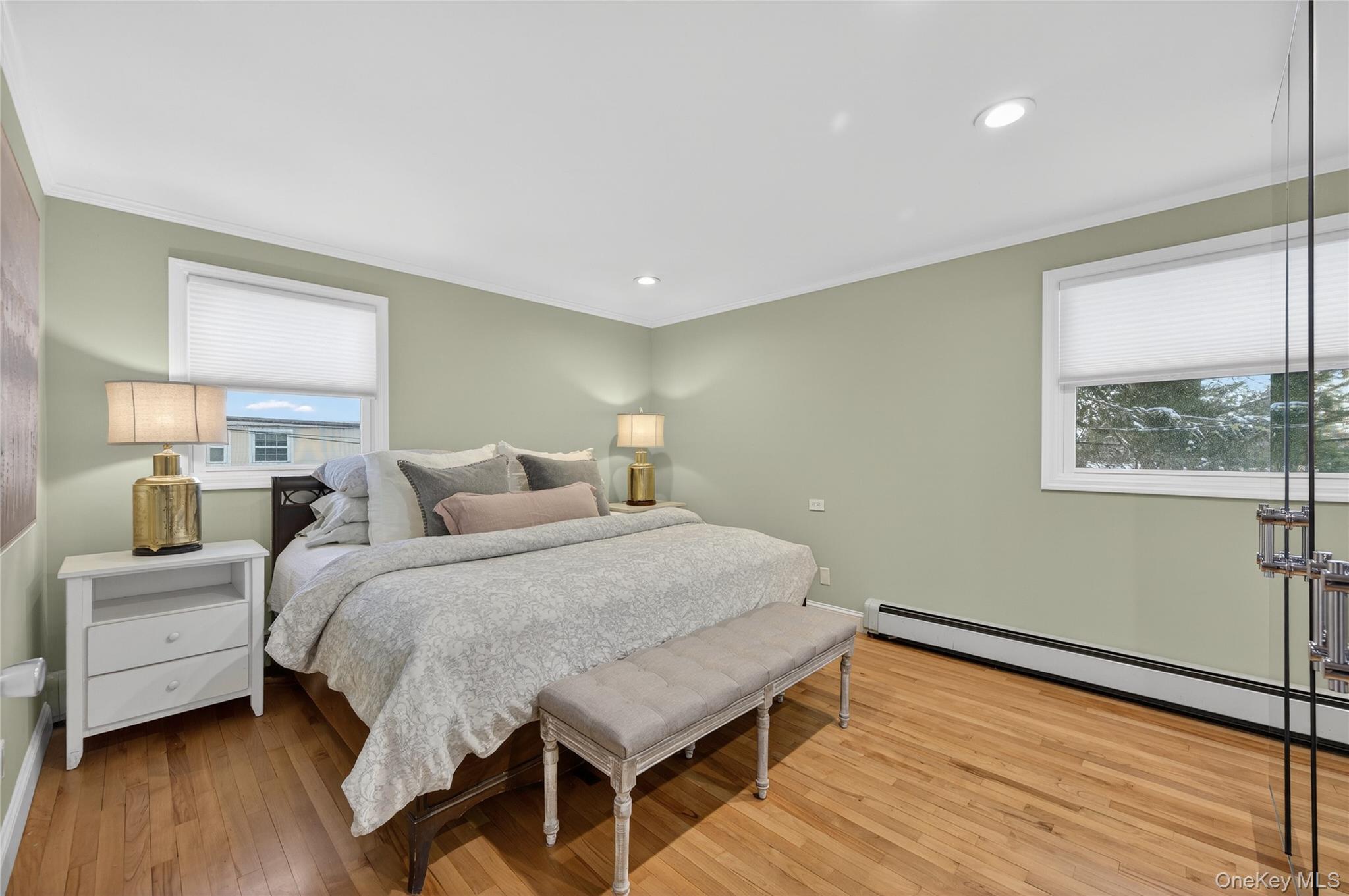 6 Dale Avenue Syosset, NY 11791 - Photo 19 of 34 a bedroom with a bed and wooden floor