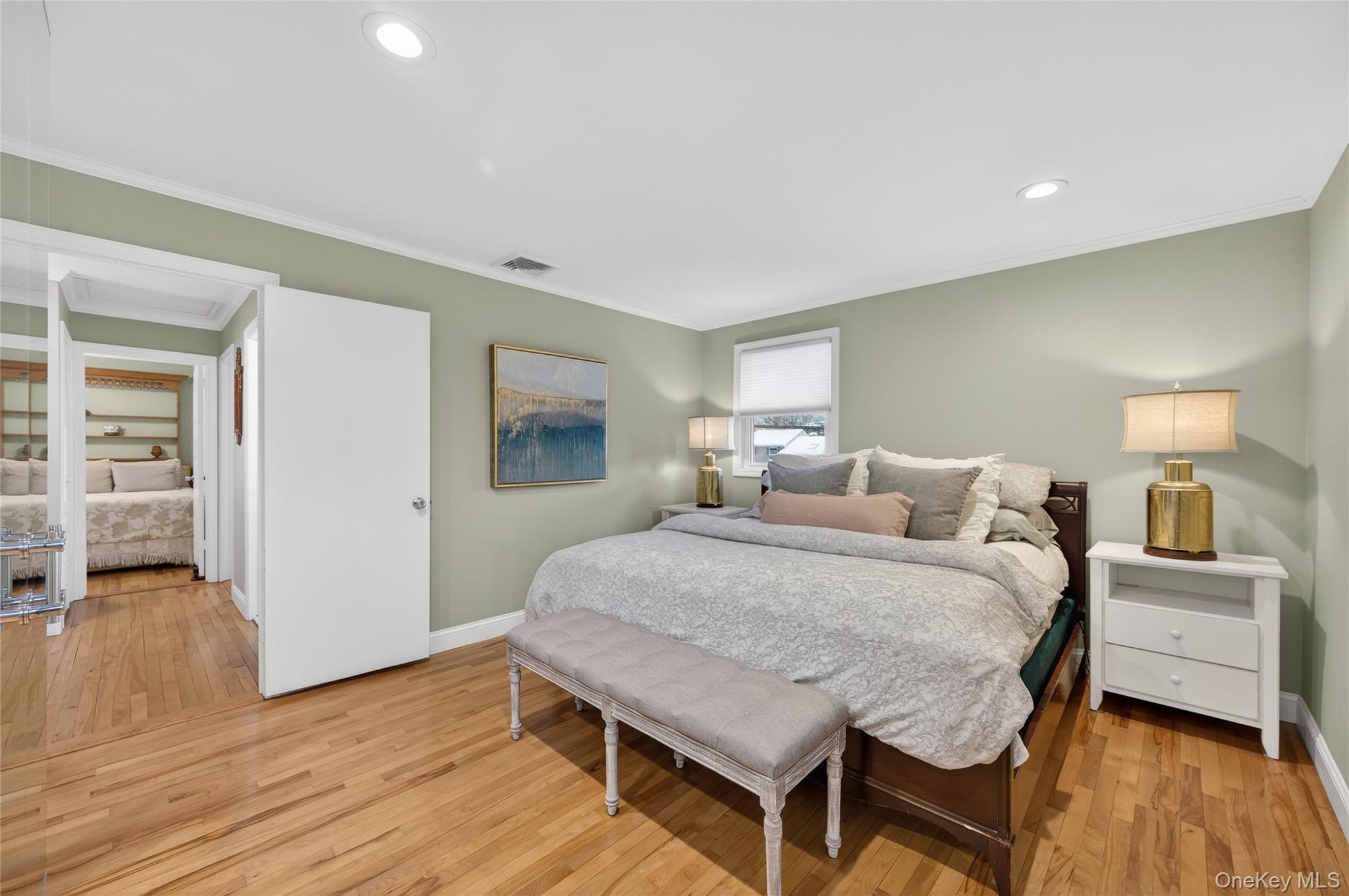 6 Dale Avenue Syosset, NY 11791 - Photo 20 of 34 a bedroom with a bed and wooden floor