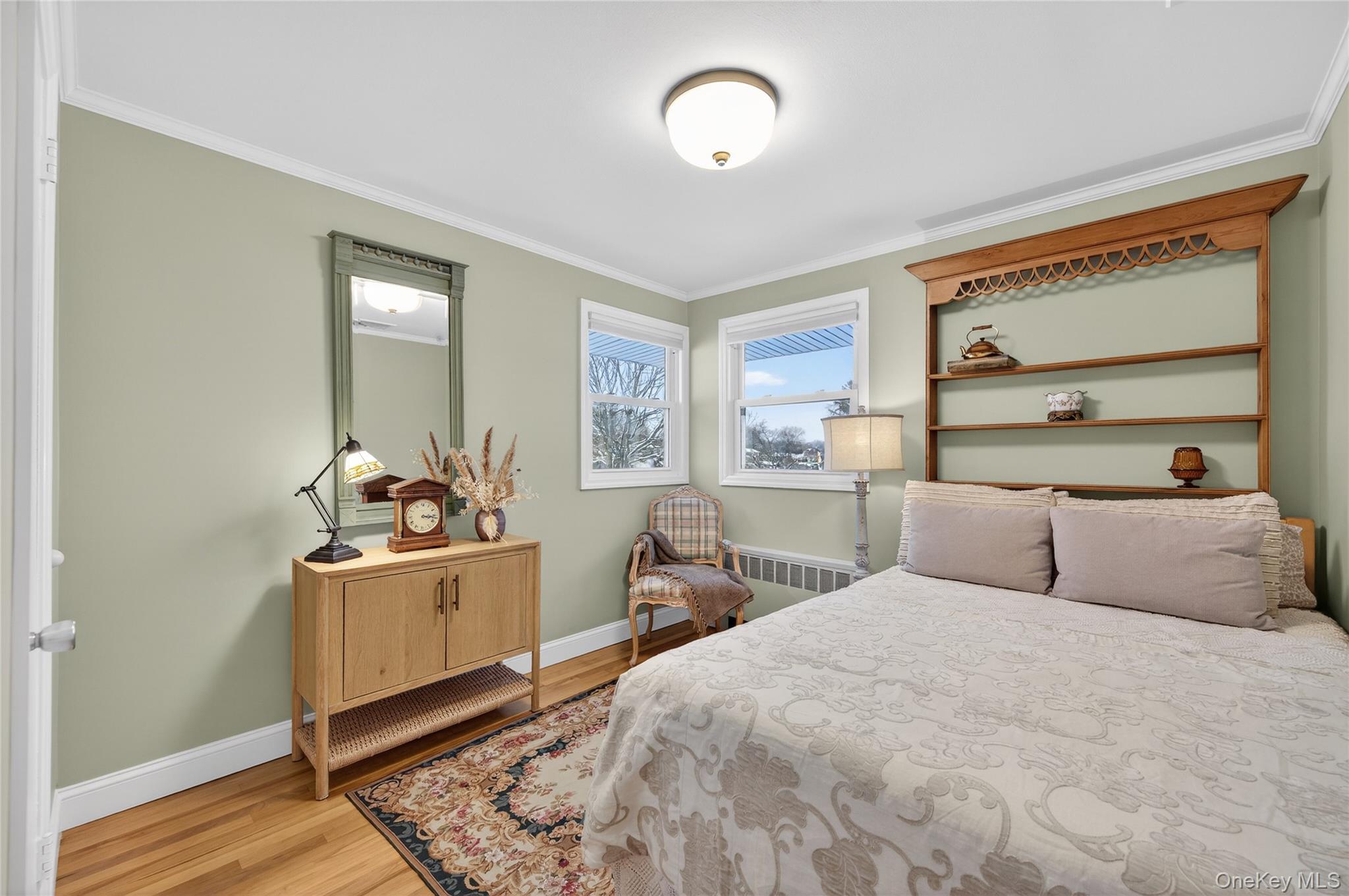 6 Dale Avenue Syosset, NY 11791 - Photo 21 of 34 a bedroom with a bed and wooden floor