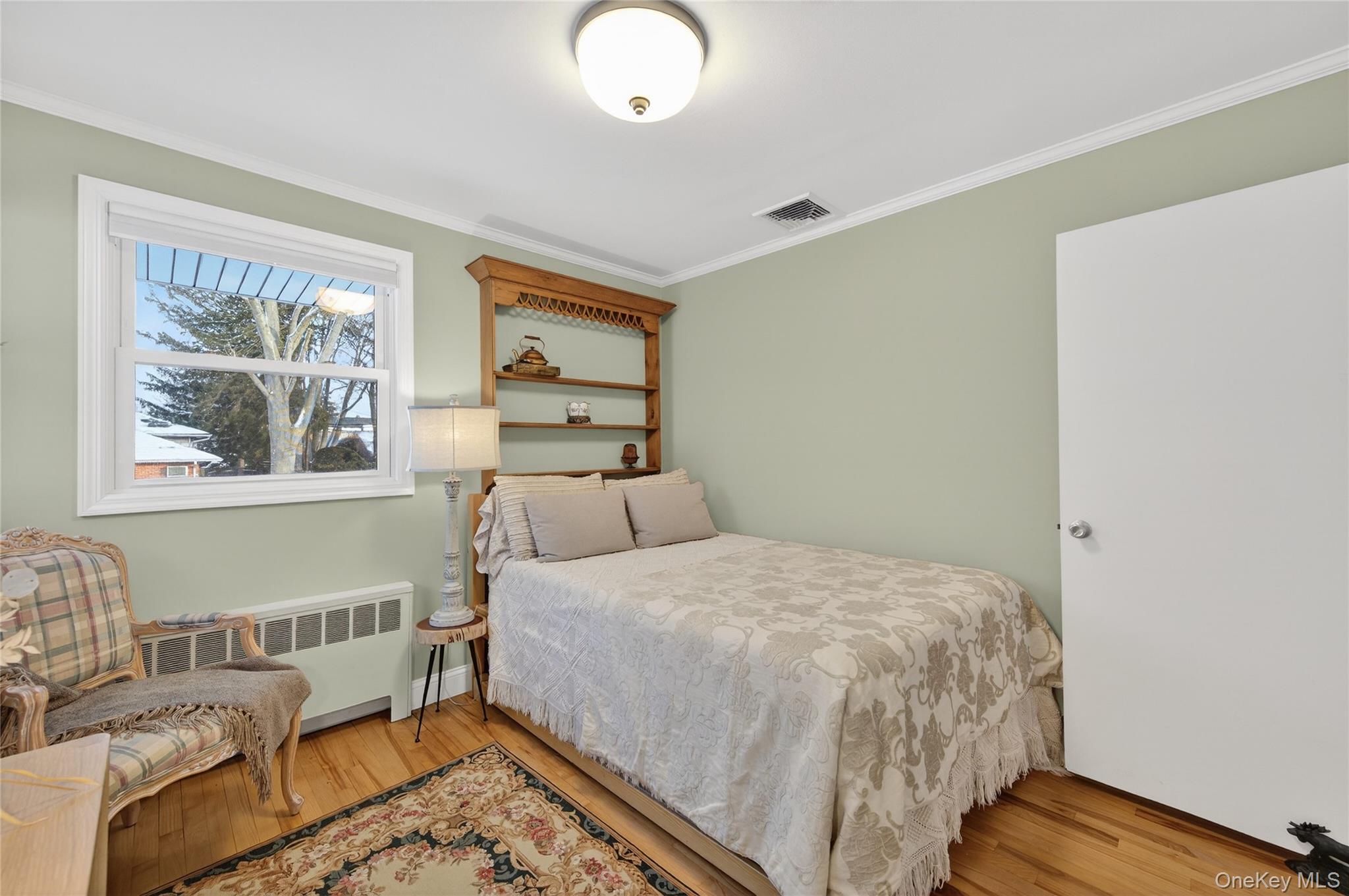 6 Dale Avenue Syosset, NY 11791 - Photo 22 of 34 a bedroom with a bed and wooden floor