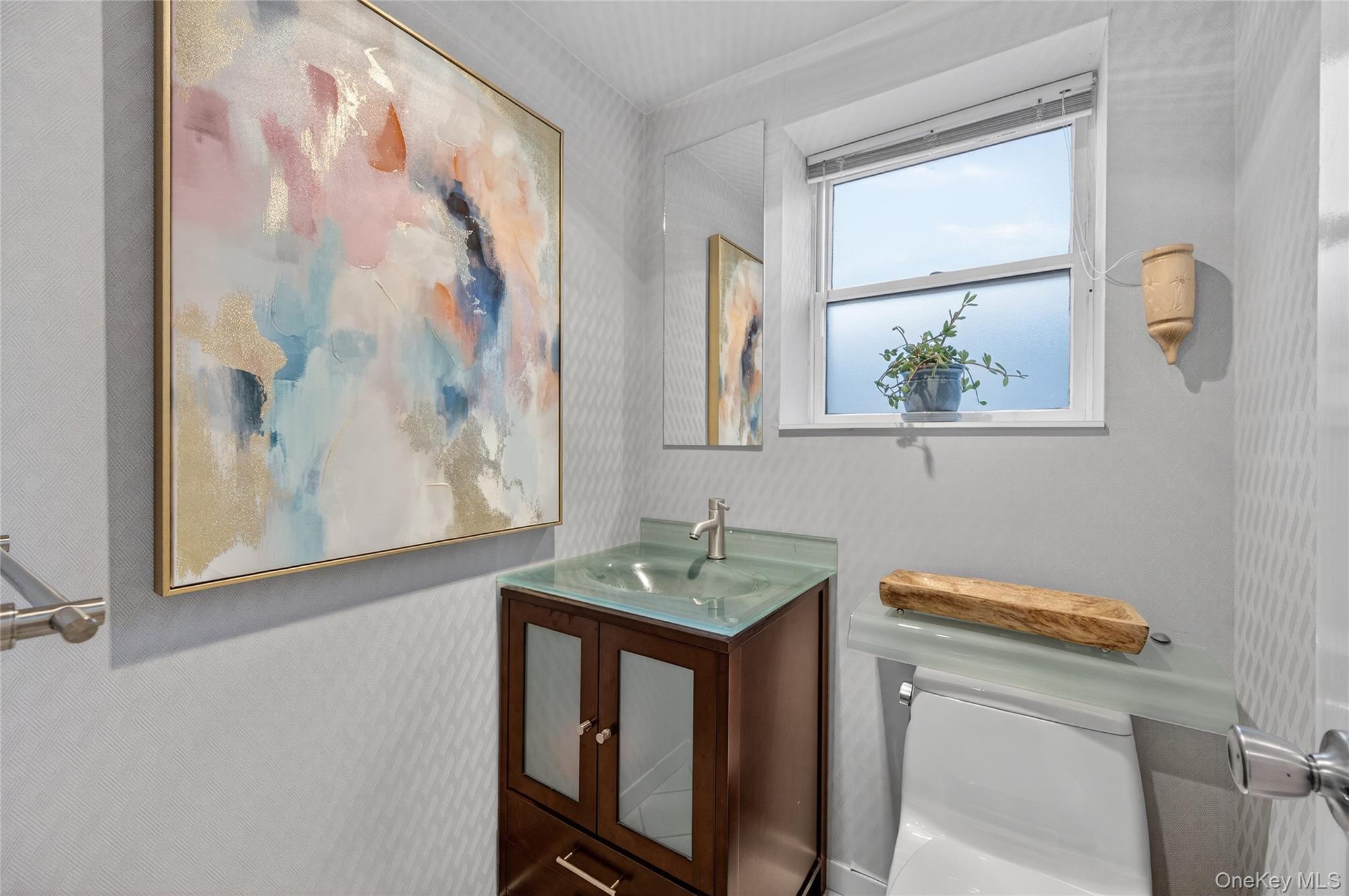 6 Dale Avenue Syosset, NY 11791 - Photo 25 of 34 a bathroom with a sink and a mirror