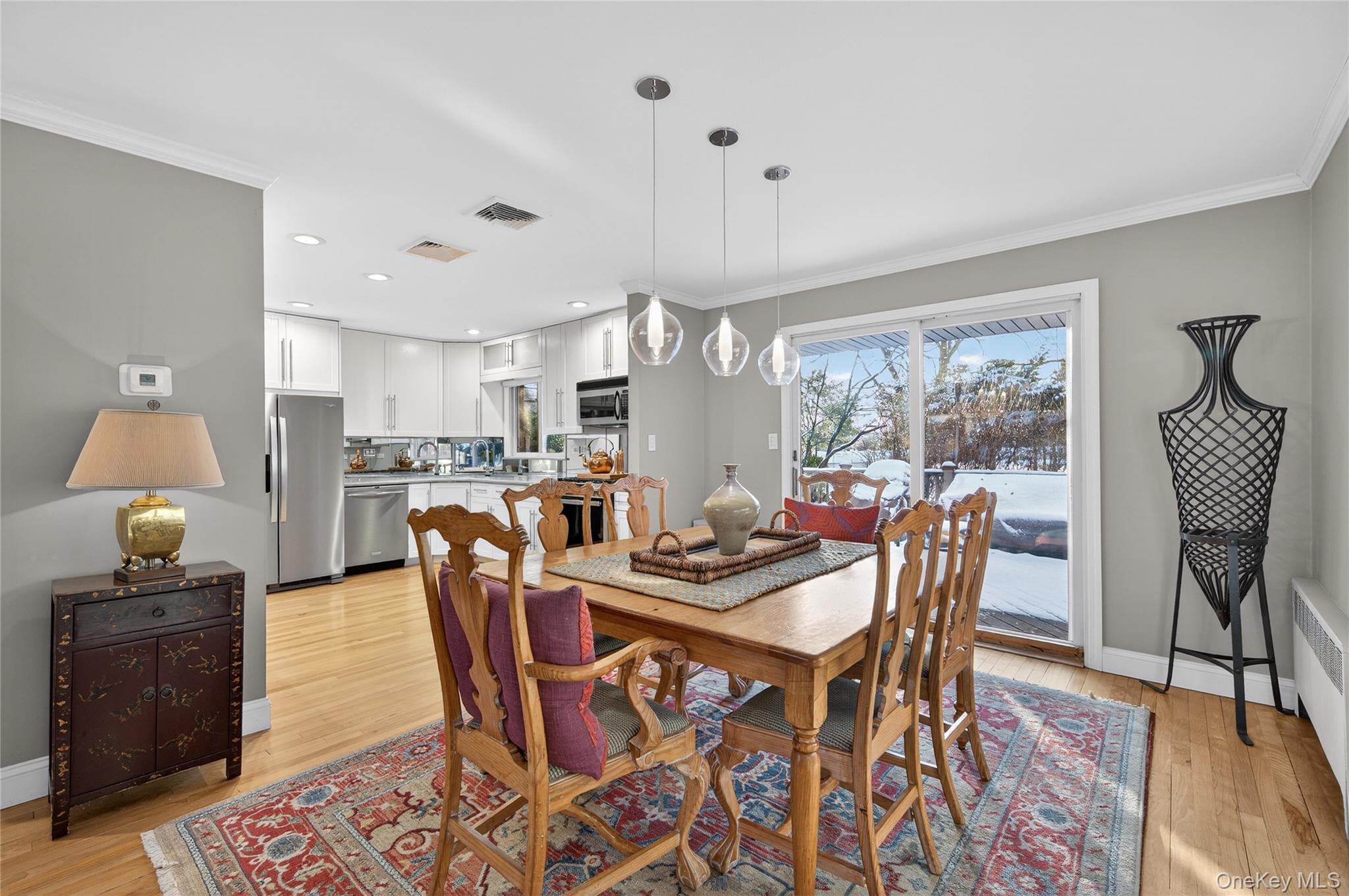 6 Dale Avenue Syosset, NY 11791 - Photo 8 of 34 a dining room with furniture a chandelier and wooden floor