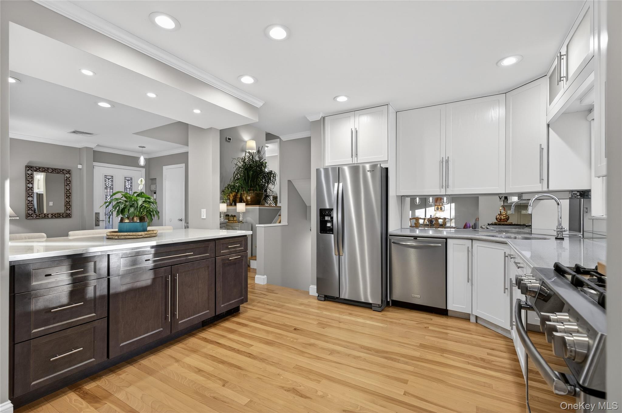 6 Dale Avenue Syosset, NY 11791 - Photo 9 of 34 a large kitchen with stainless steel appliances granite countertop a refrigerator and a stove top oven