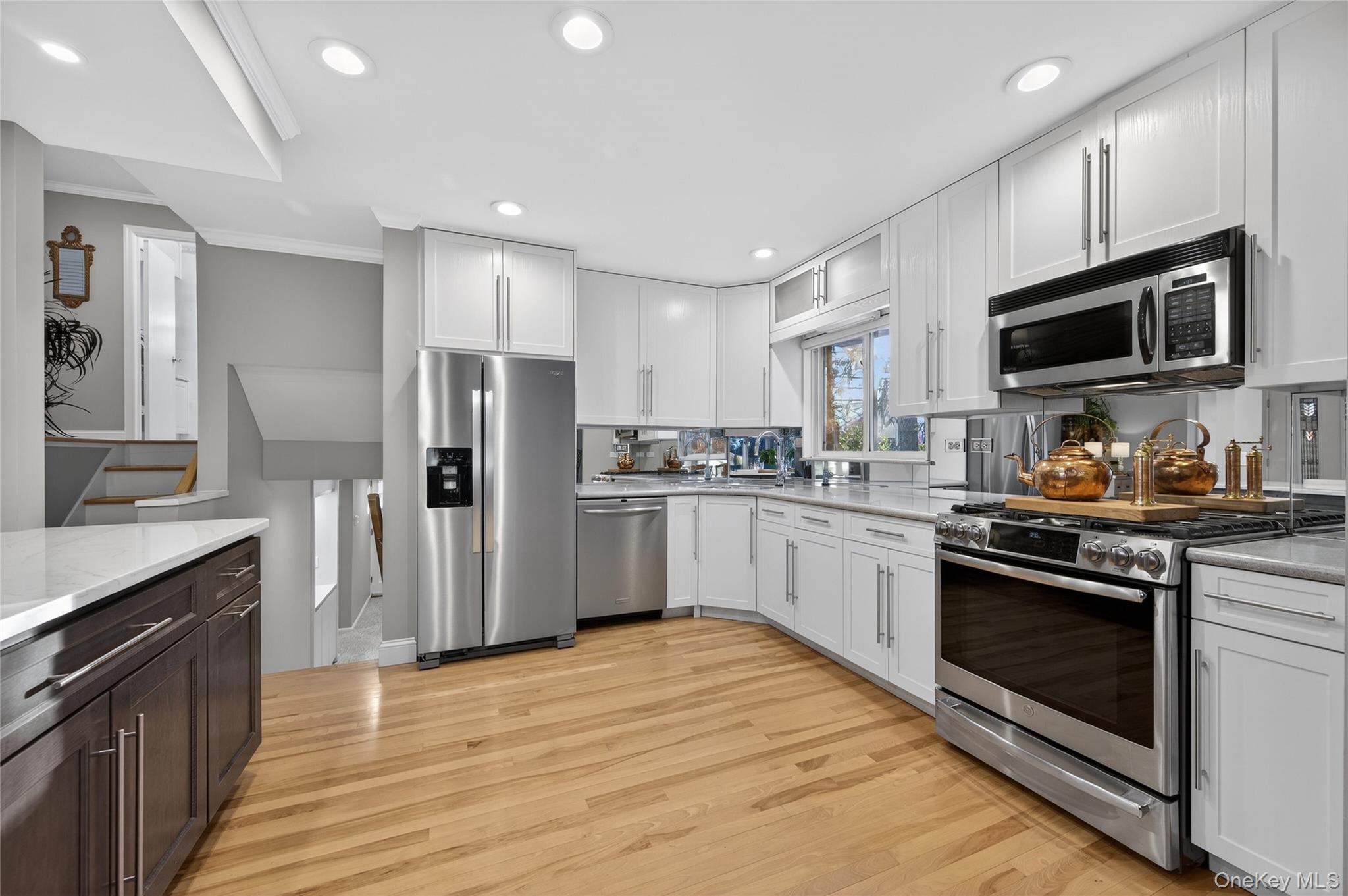 6 Dale Avenue Syosset, NY 11791 - Photo 10 of 34 a kitchen with granite countertop a refrigerator stove top oven and sink