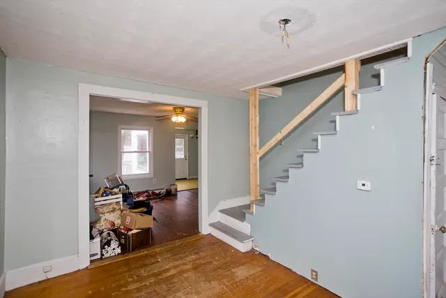 a view of a livingroom with furniture and a workspace