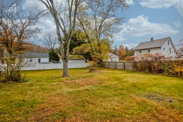 a view of a swimming pool with an outdoor space and seating area