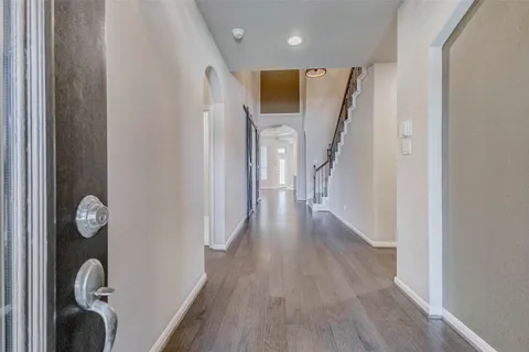 a view of entryway with wooden floor