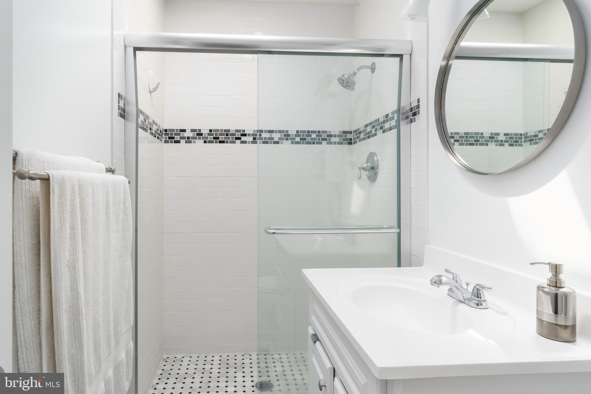 2205 Ontario Road Northwest Washington, DC 20009 - Photo 22 of 31 Updated bath with walk-in shower and glass doors.