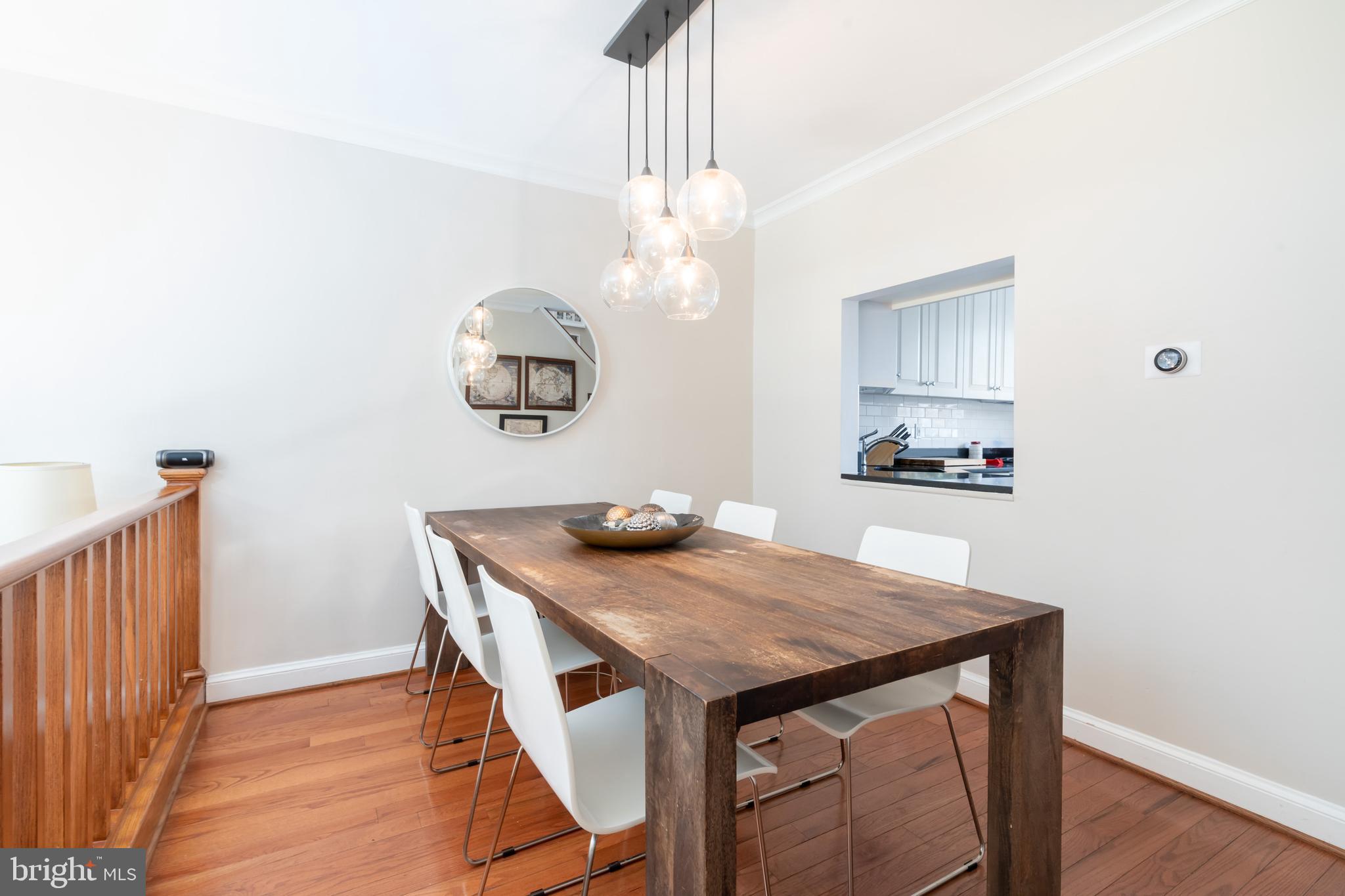 2205 Ontario Road Northwest Washington, DC 20009 - Photo 4 of 31 Hardwood floors warm the dining room.