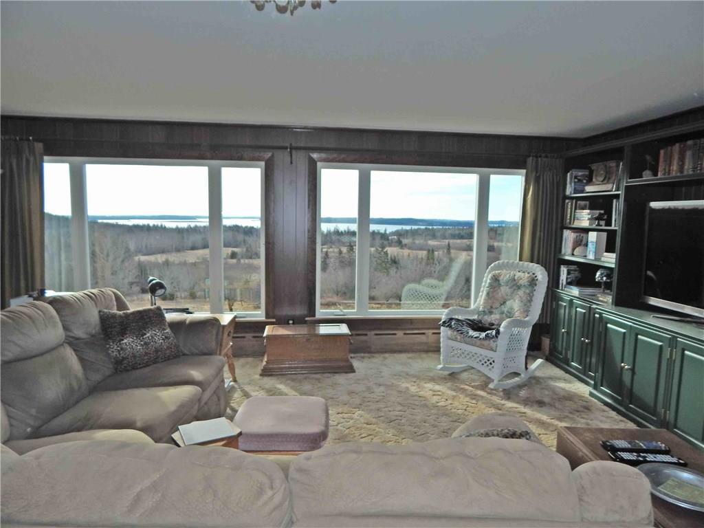 232 Cannon Hill Road Perry, ME 04667 - Photo 18 of 34 Large living room with built in TV...