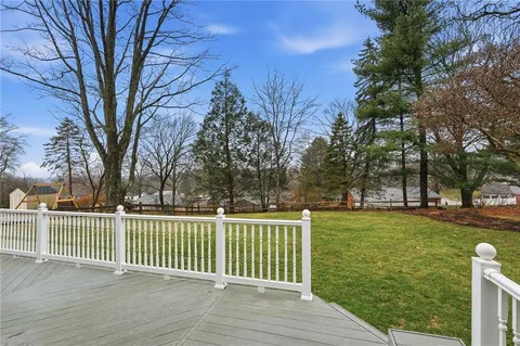 a view of a wooden fence and trees around