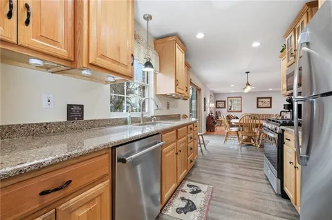 a kitchen with lots of counter top space and stainless steel appliances