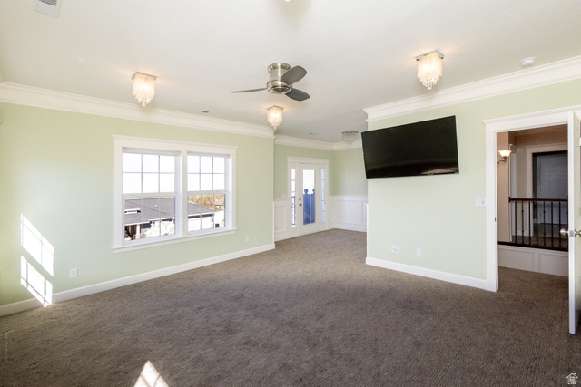 434 Cardon Ridge Drive Smithfield, UT 84335 - Photo 18 of 59 Carpeted empty room featuring wainscoting, ornamental molding, a decorative wall, and a ceiling fan