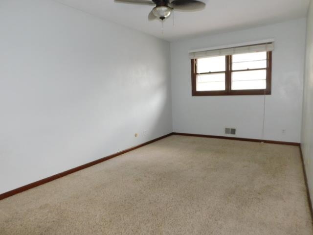 4406 Crawford Drive, Unit B Rockford, IL 61114 - Photo 8 of 15 an empty room with a window