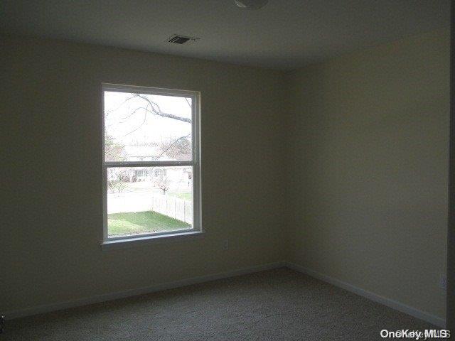 655 Bourdois Avenue Bellport, NY 11713 - Photo 16 of 28 an empty room with a window