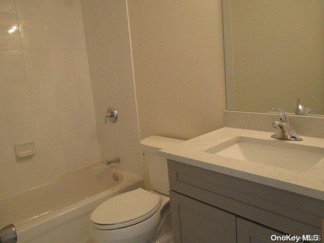 655 Bourdois Avenue Bellport, NY 11713 - Photo 22 of 28 a bathroom with a sink a toilet and shower