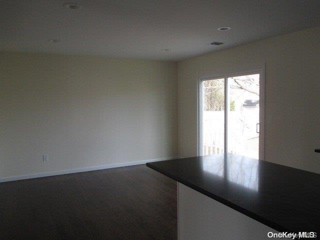 655 Bourdois Avenue Bellport, NY 11713 - Photo 8 of 28 a view of an empty room and a window