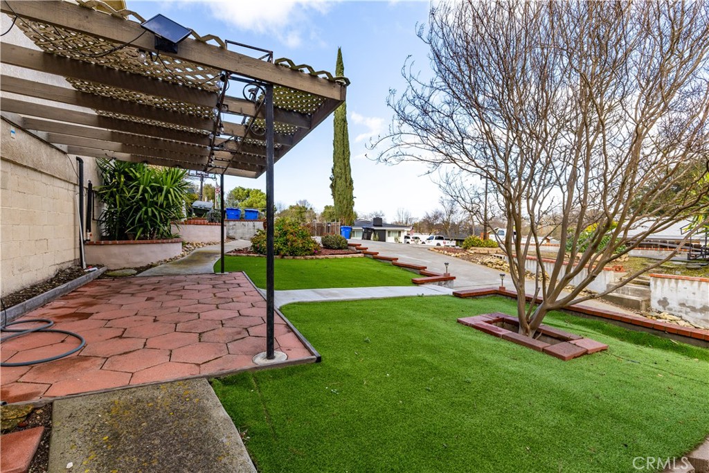 323 Crum Road Templeton, CA 93465 - Photo 45 of 60 Side yard with covered patio and faux grass