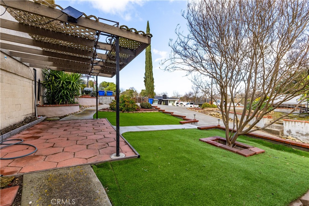 323 Crum Road Templeton, CA 93465 - Photo 45 of 60 Side yard with covered patio and faux grass