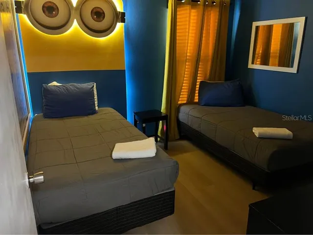 a bedroom with a bed and window