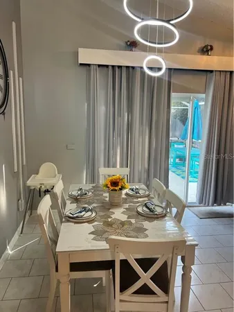 a kitchen with a table and chairs