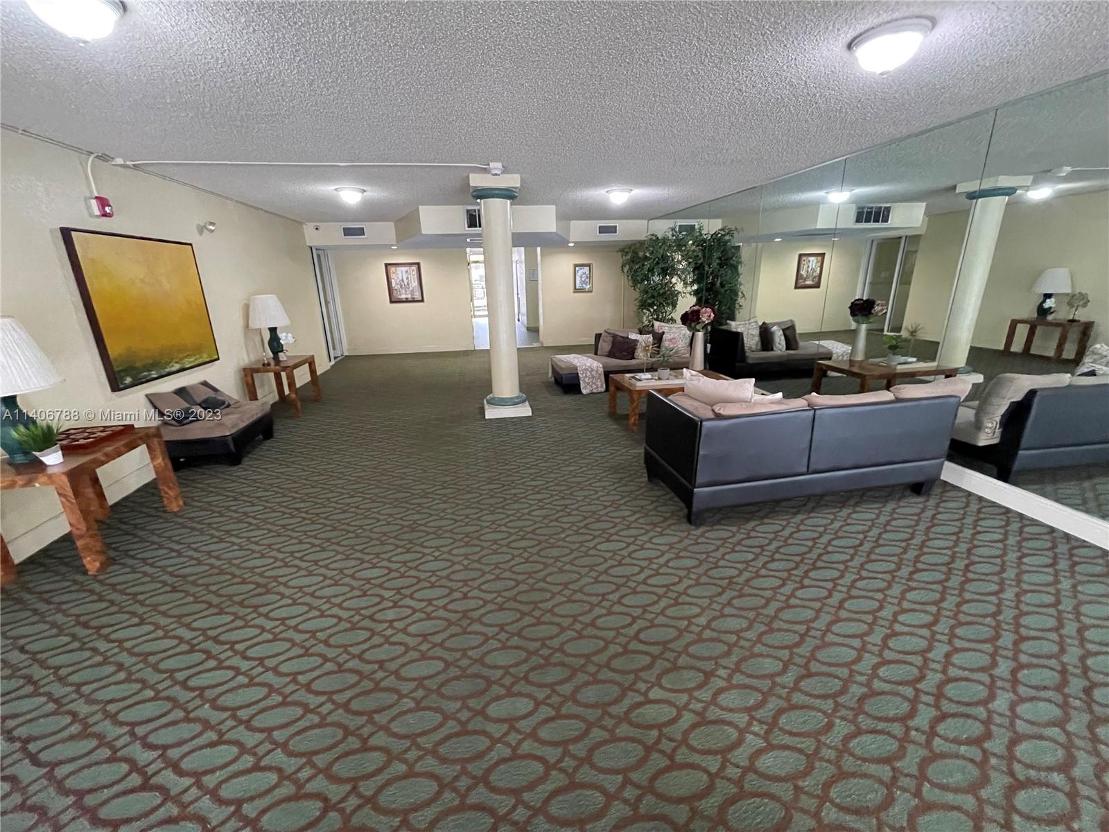 6861 Southwest 147th Avenue, Unit 2G Miami, FL 33193 - Photo 3 of 34 a living room with furniture