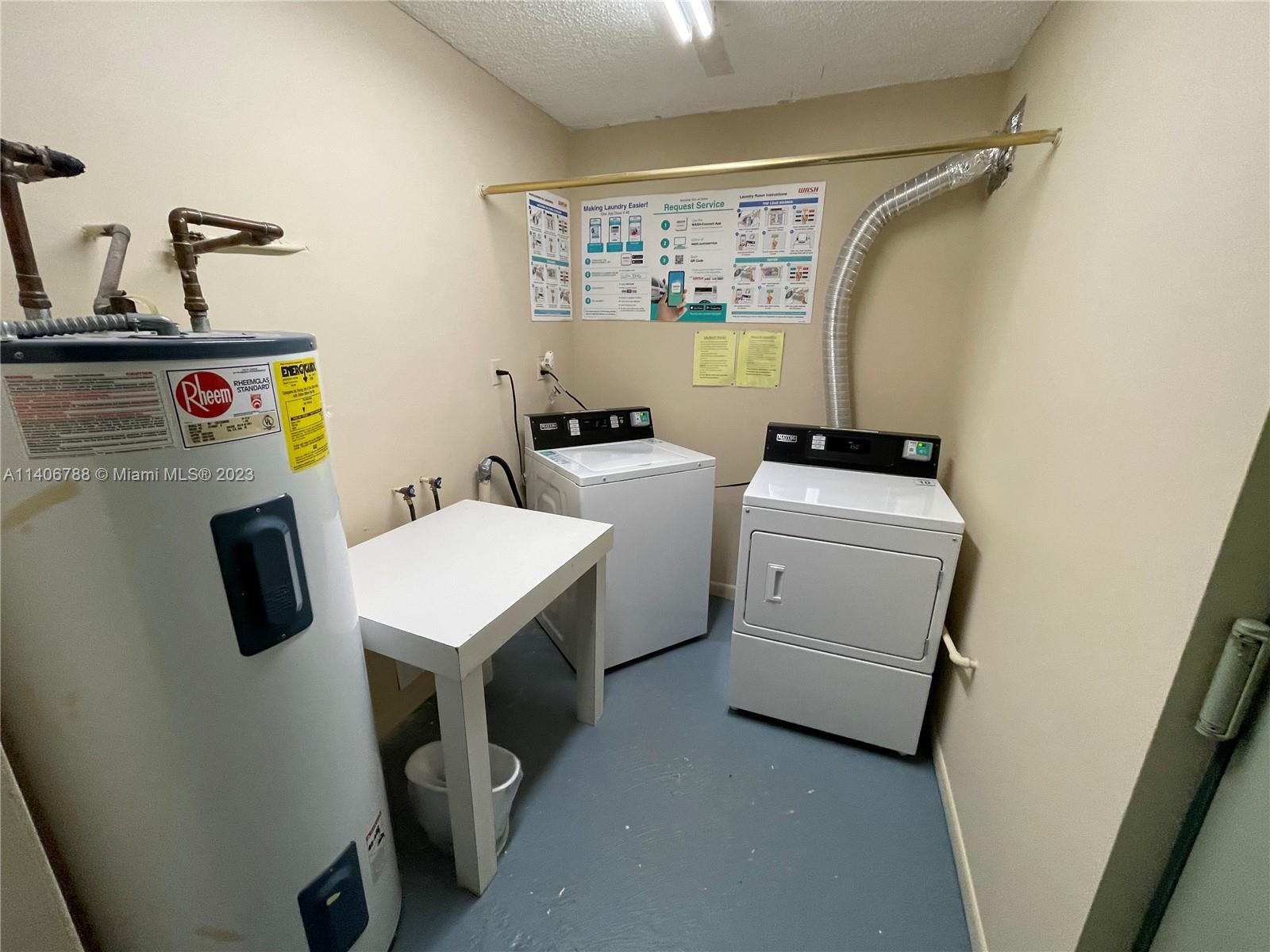 6861 Southwest 147th Avenue, Unit 2G Miami, FL 33193 - Photo 31 of 34 a utility room with dryer and washer