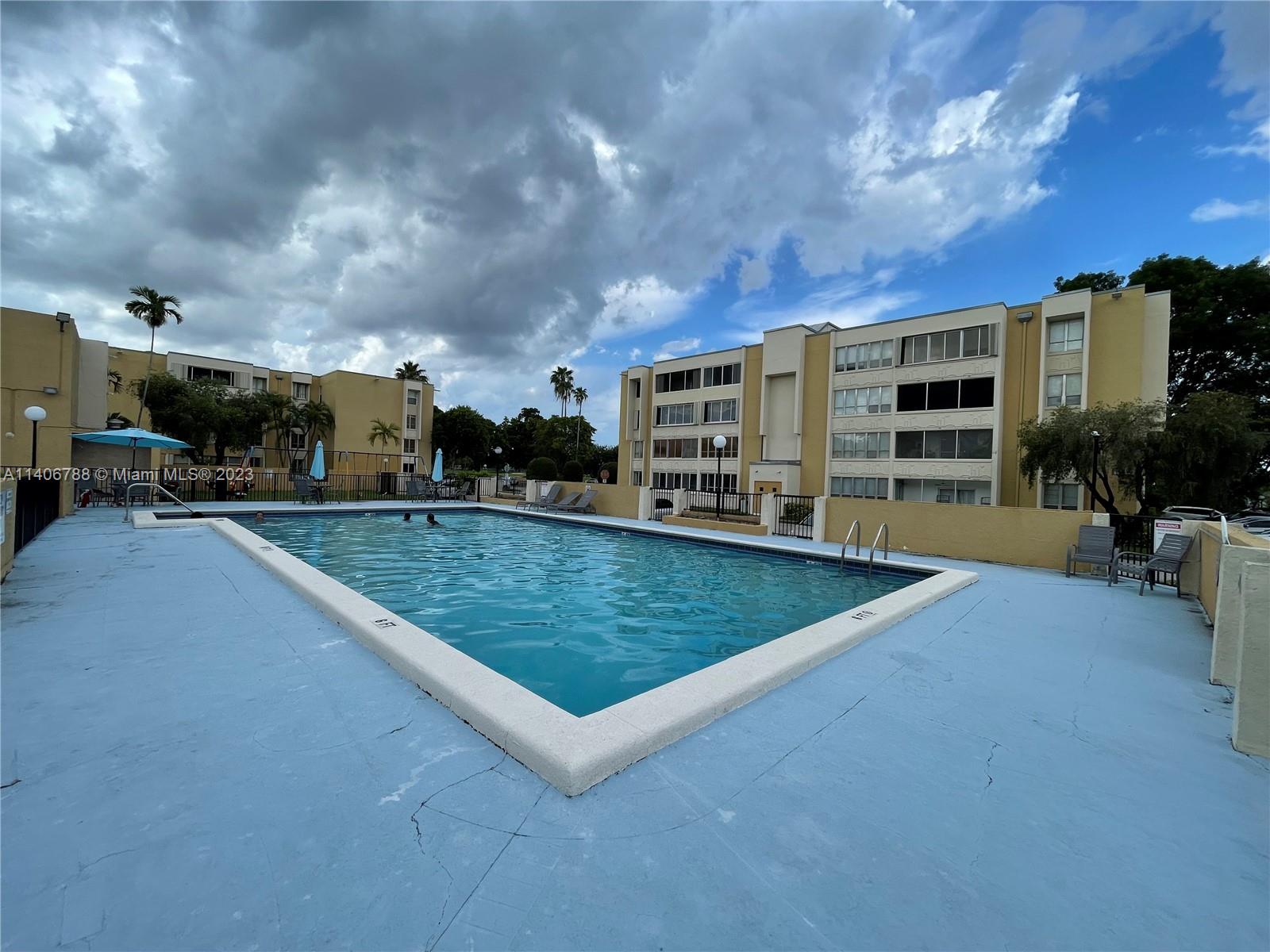 6861 Southwest 147th Avenue, Unit 2G Miami, FL 33193 - Photo 34 of 34 a view of a house with a yard