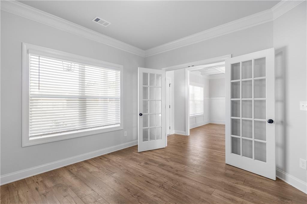 450 Banff Drive Winder, GA 30680 - Photo 10 of 19 a view of wooden floor and windows in a room