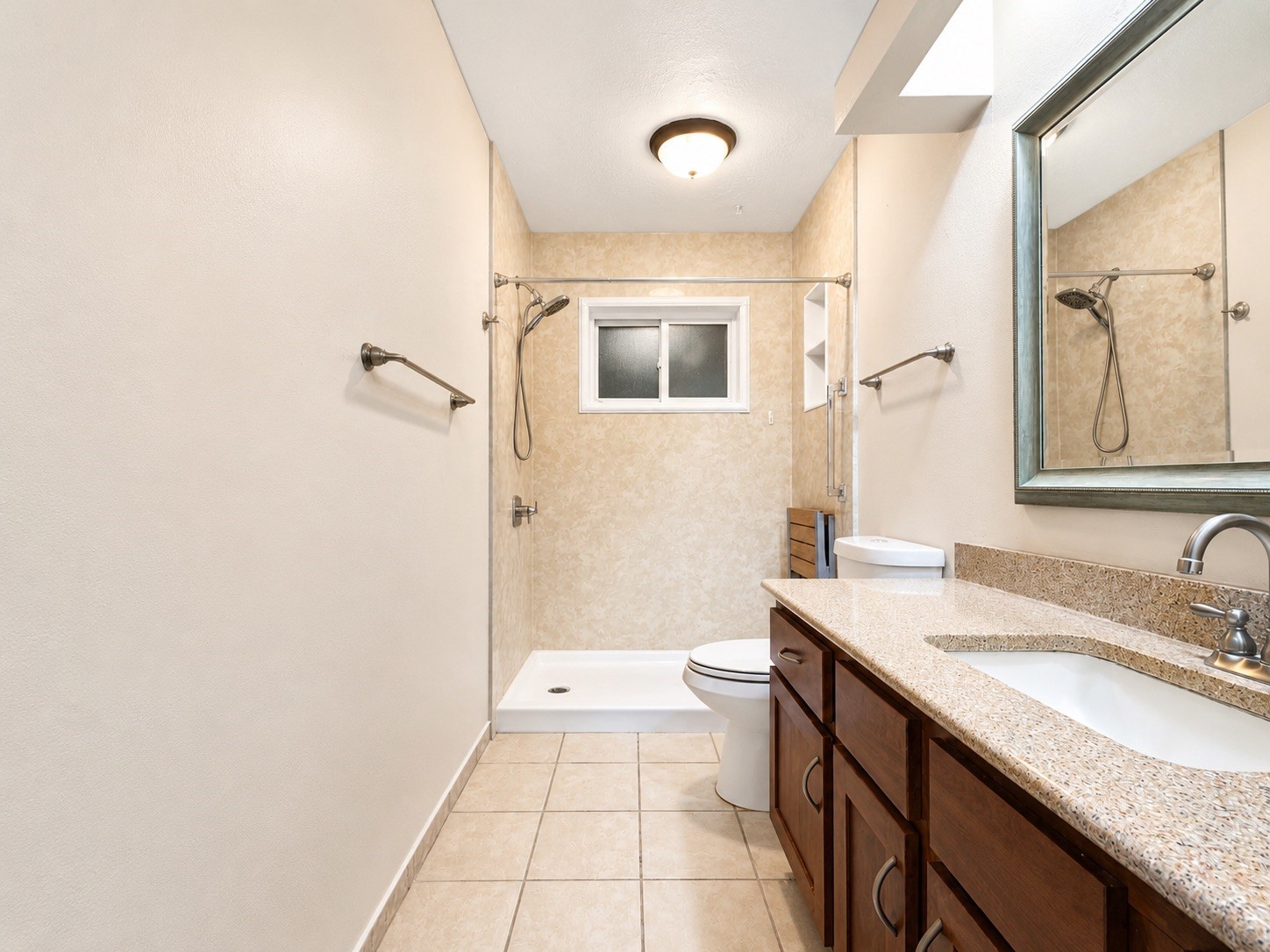 5810 Sunnygate Drive Spring, TX 77373 - Photo 5 of 16 a bathroom with a granite countertop sink a mirror and a bathtub