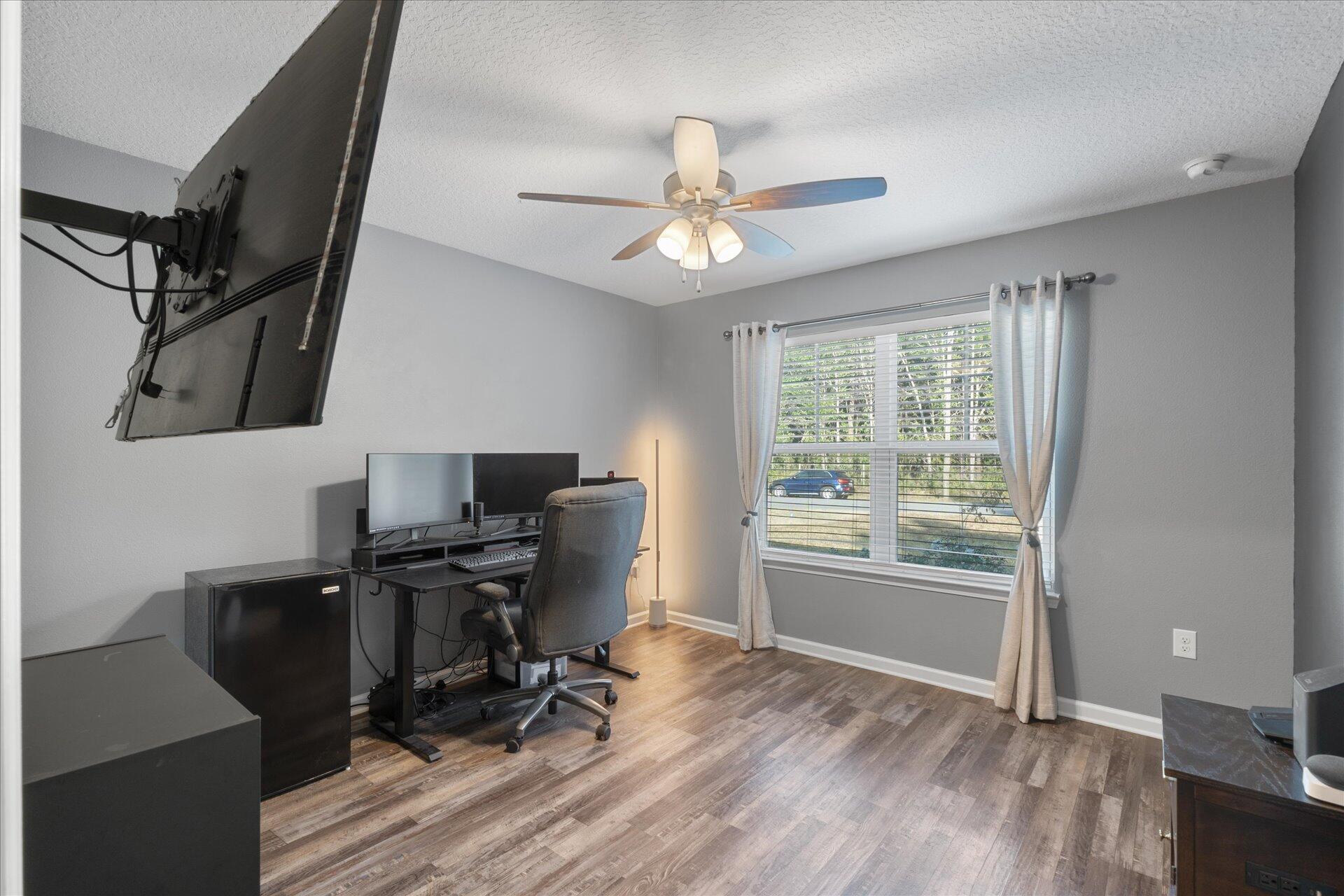 6052 Eden Road Crestview, FL 32539 - Photo 11 of 42 a view of a workspace with furniture and a window