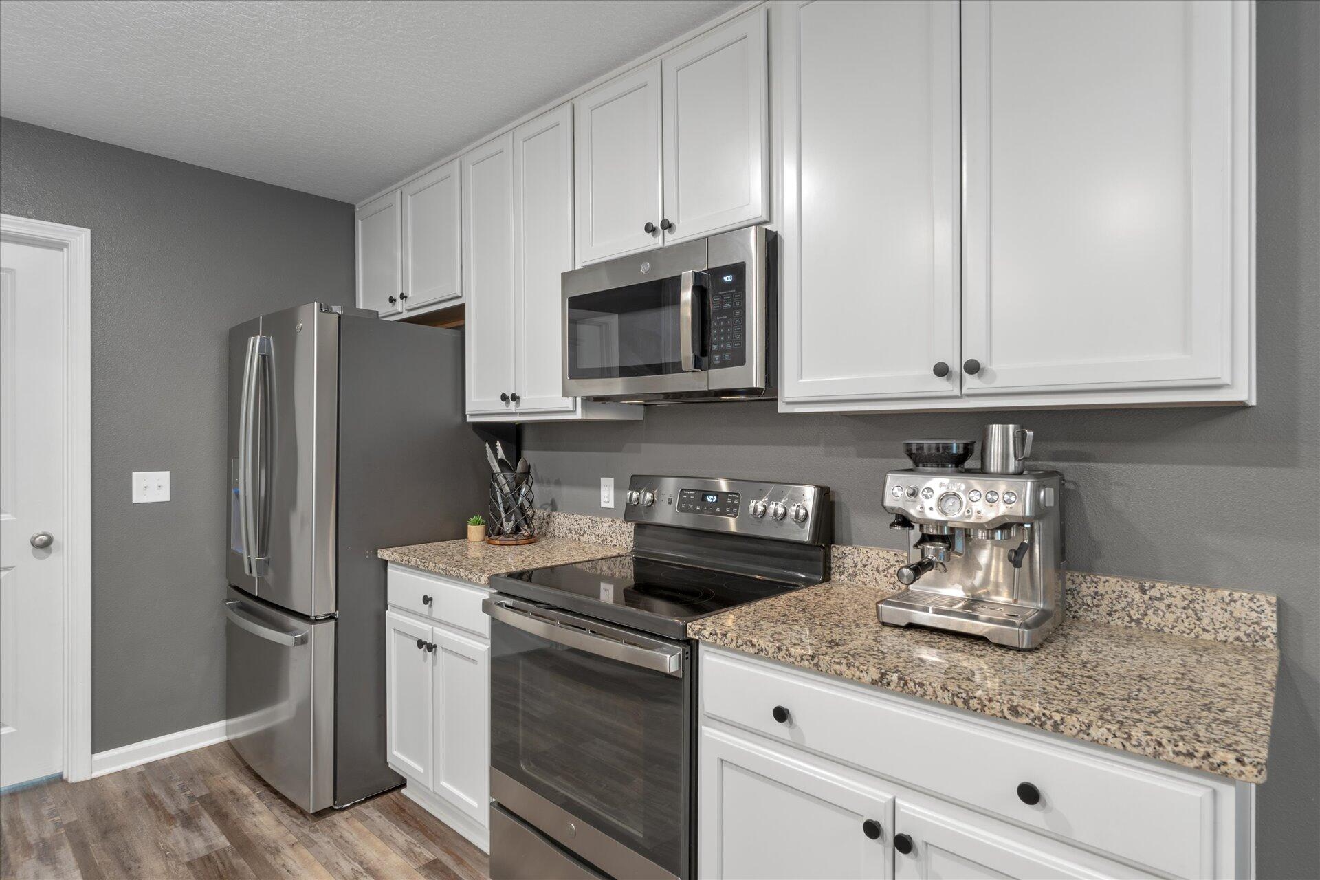 6052 Eden Road Crestview, FL 32539 - Photo 16 of 42 a kitchen with stainless steel appliances granite countertop a refrigerator sink and stove