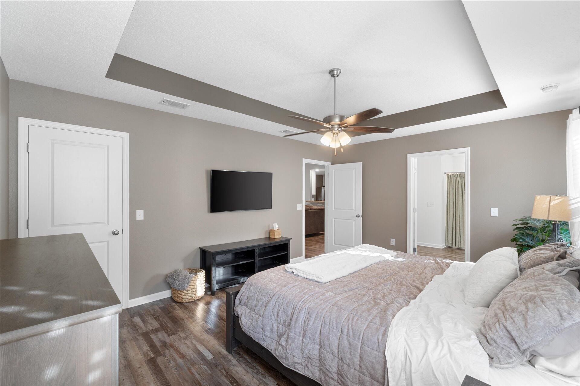 6052 Eden Road Crestview, FL 32539 - Photo 23 of 42 a bedroom with a bed and a flat screen tv