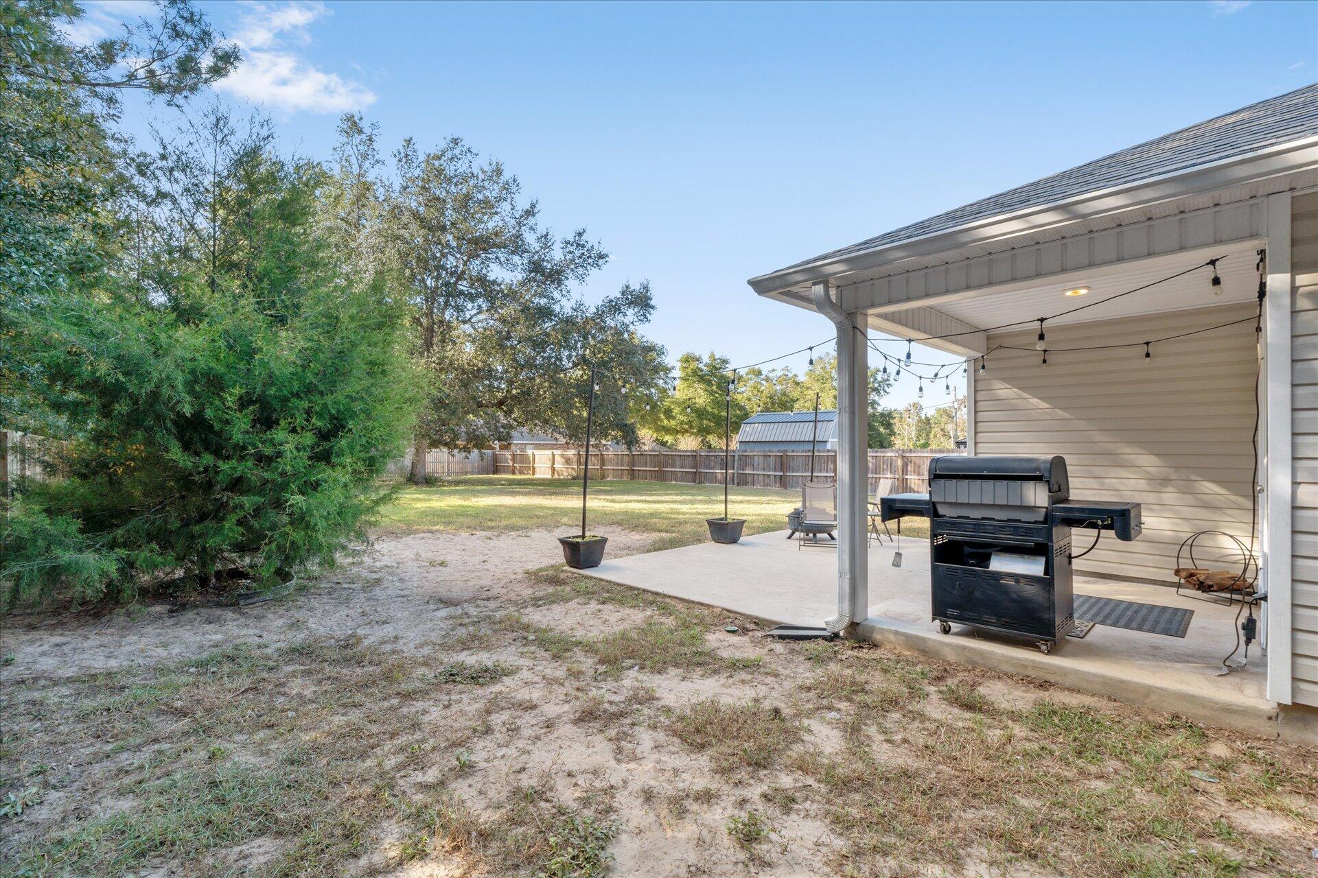 6052 Eden Road Crestview, FL 32539 - Photo 28 of 42 a view of a terrace with a garden