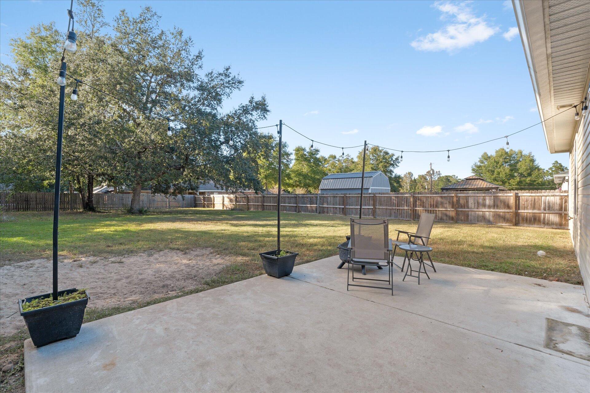 6052 Eden Road Crestview, FL 32539 - Photo 29 of 42 a view of a yard with a slide