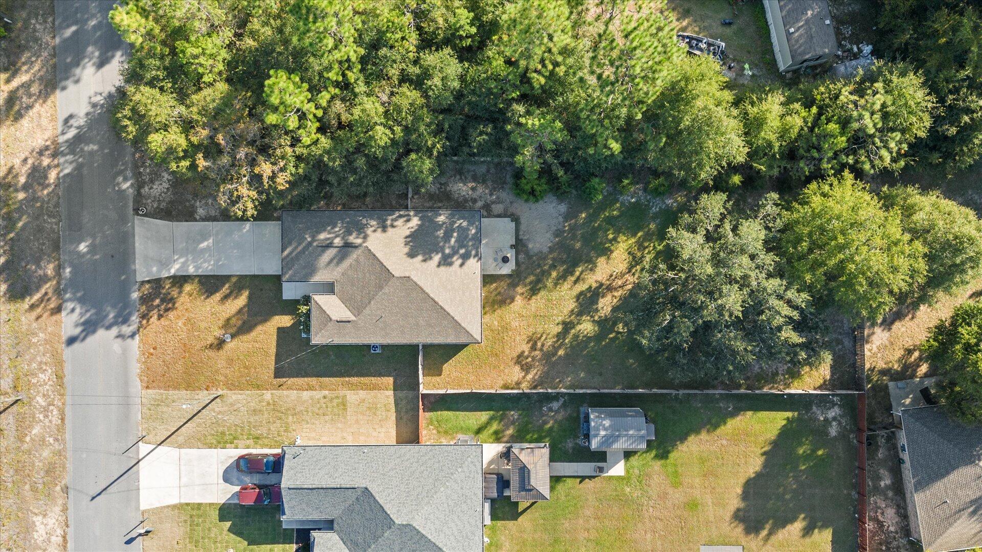 6052 Eden Road Crestview, FL 32539 - Photo 33 of 42 an aerial view of a house with swimming pool and a patio