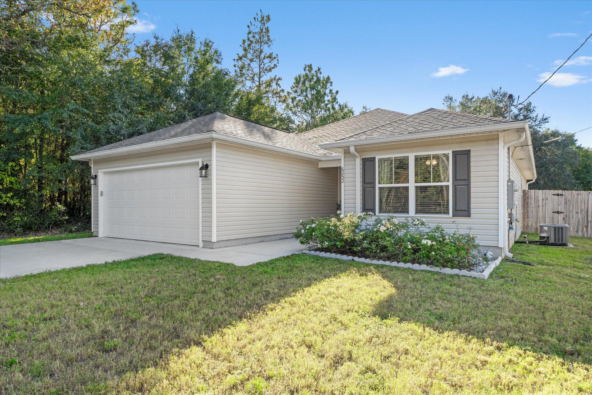 6052 Eden Road Crestview, FL 32539 - Photo 40 of 42 a front view of a house with garden
