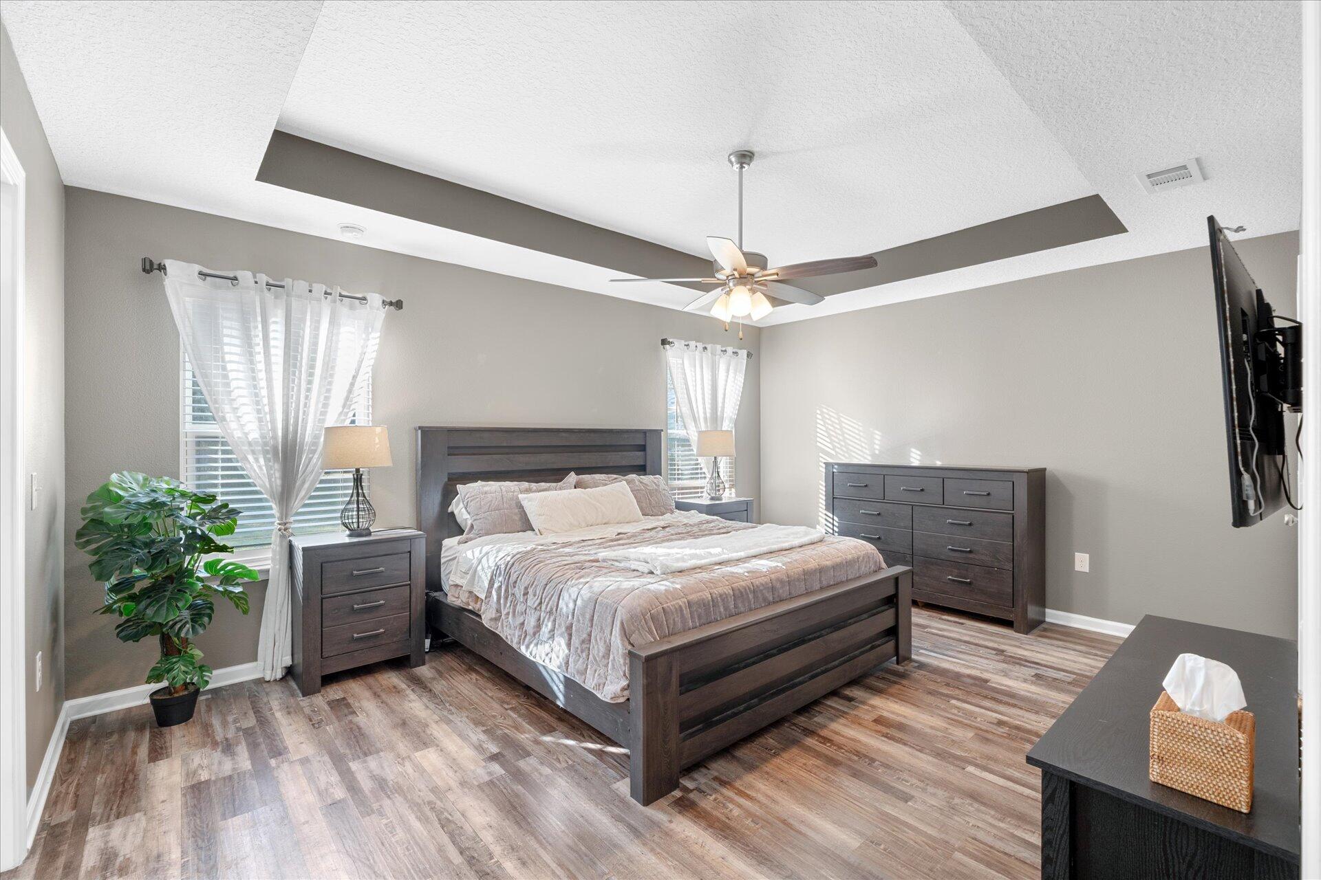 6052 Eden Road Crestview, FL 32539 - Photo 5 of 42 a bedroom with a bed and a potted plant