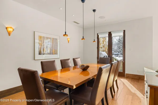 a view of a dining room with furniture and window