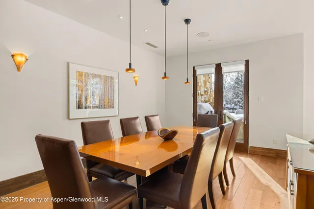a view of a dining room with furniture and window