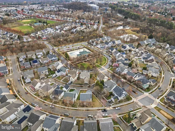 an aerial view of residential houses with outdoor space