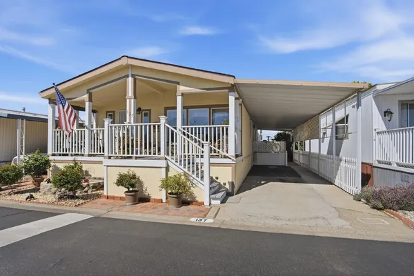 a view of a pathway of a house with wooden stairs