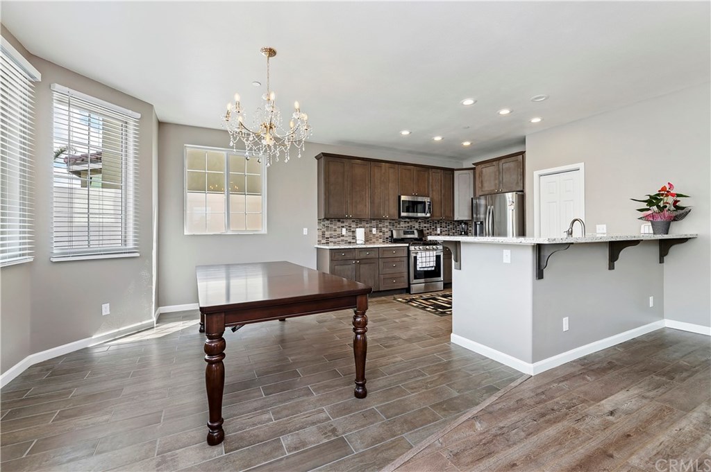 3591 Tyco Drive Riverside, CA 92501 - Photo 13 of 30 a kitchen with a sink a window and stainless steel appliances