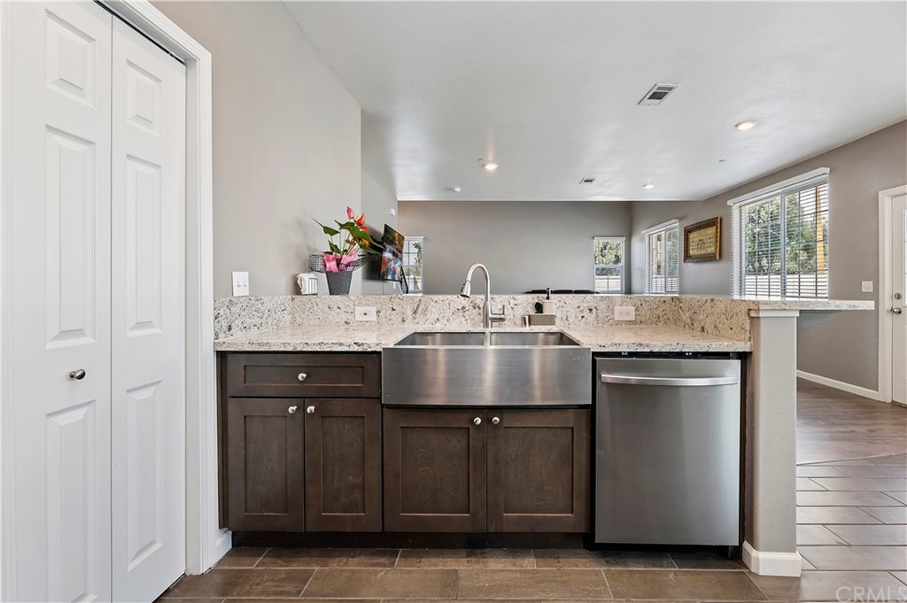 3591 Tyco Drive Riverside, CA 92501 - Photo 18 of 30 a kitchen with a sink cabinets and wooden floor