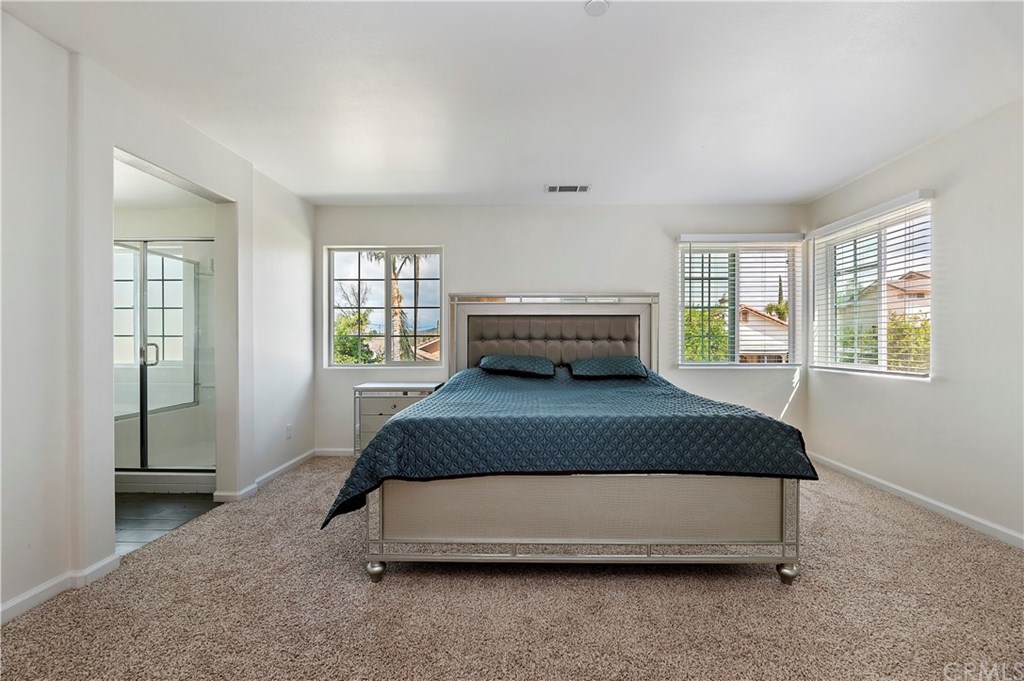 3591 Tyco Drive Riverside, CA 92501 - Photo 19 of 30 a bedroom with a bed and window