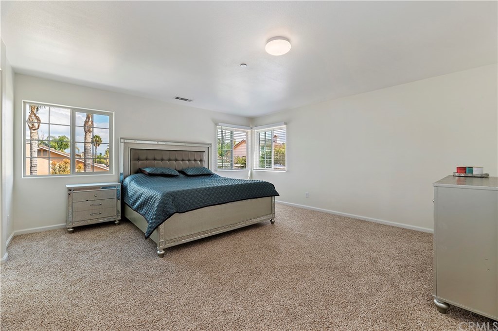 3591 Tyco Drive Riverside, CA 92501 - Photo 20 of 30 a bedroom with a bed and a window
