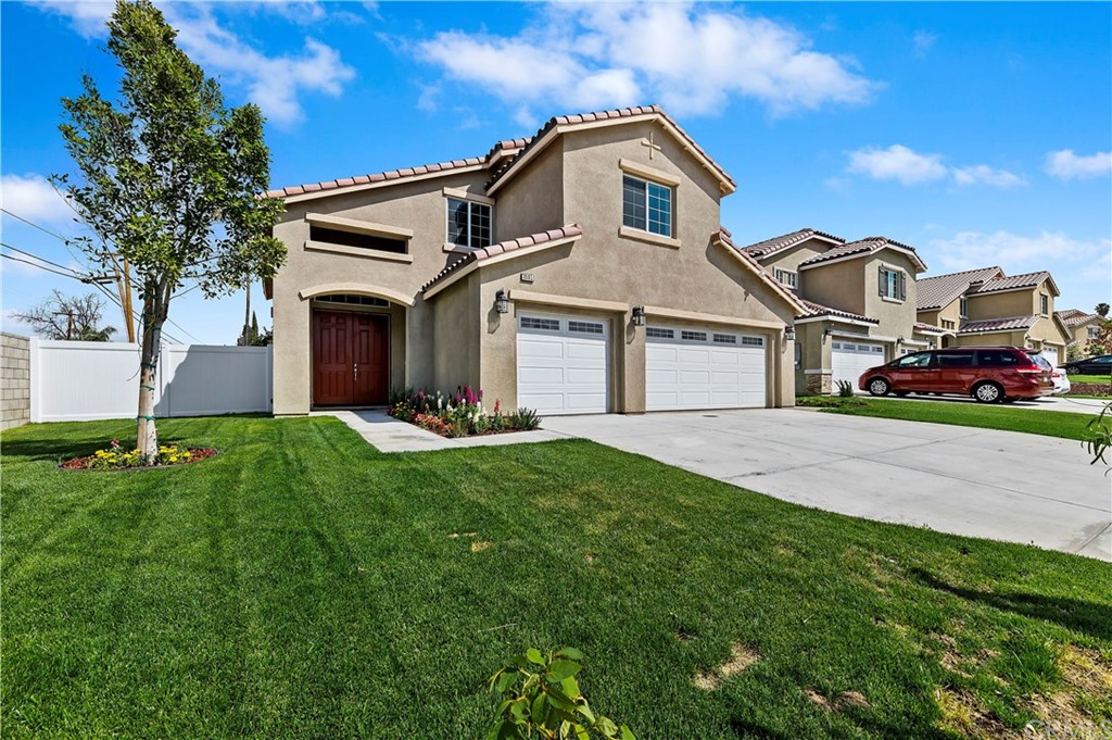 3591 Tyco Drive Riverside, CA 92501 - Photo 2 of 30 a front view of a house with a garden and yard