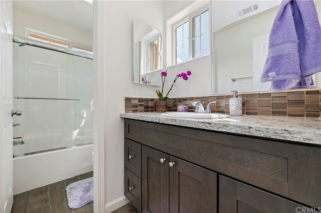 3591 Tyco Drive Riverside, CA 92501 - Photo 24 of 30 a bathroom with a sink and a mirror