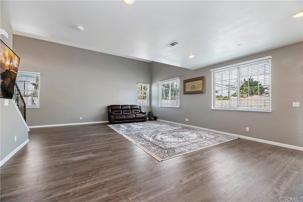 3591 Tyco Drive Riverside, CA 92501 - Photo 10 of 30 a view of a livingroom with wooden floor and a flat screen tv